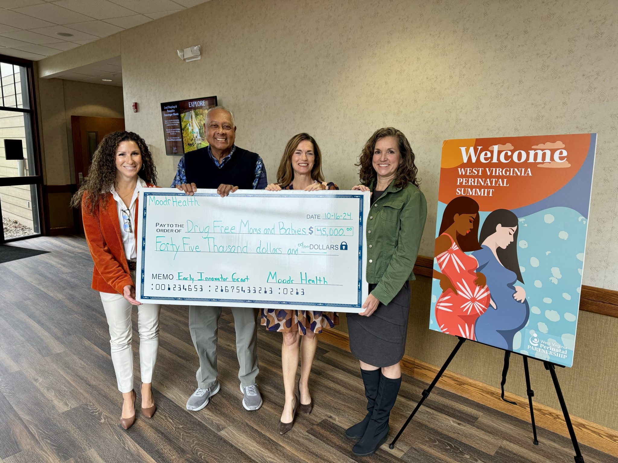 Moodr Health receiving the DFMB Innovator Grant award